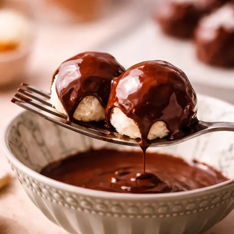 Delicious no bake coconut cream balls on a plate, perfect for holiday treats.