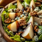 Caramelized Pear and Blue Cheese Salad topped with walnuts