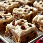 Delicious oatmeal raisin cookie bars topped with raisins and oats